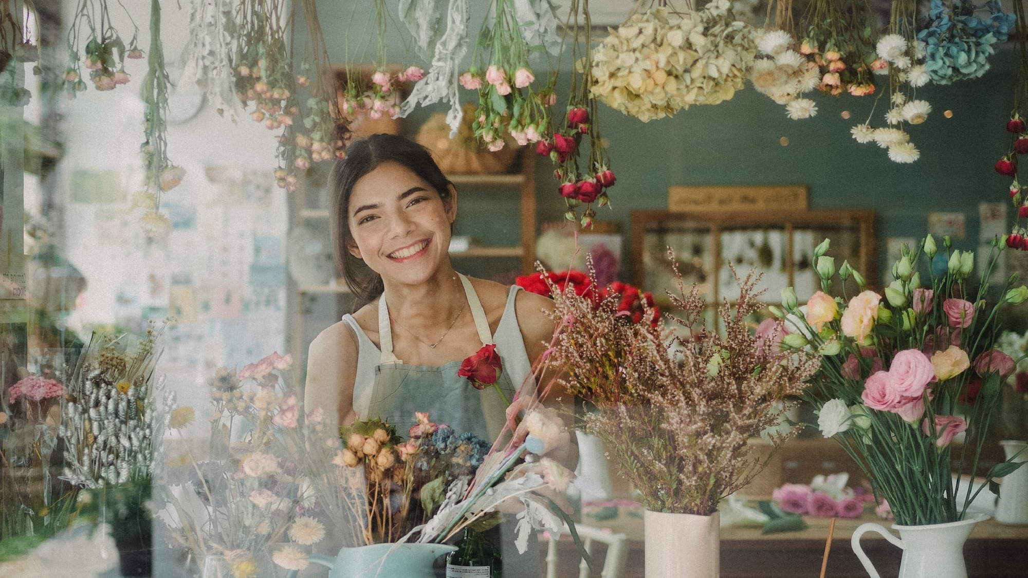 Couple sitting together on couch looking at laptop