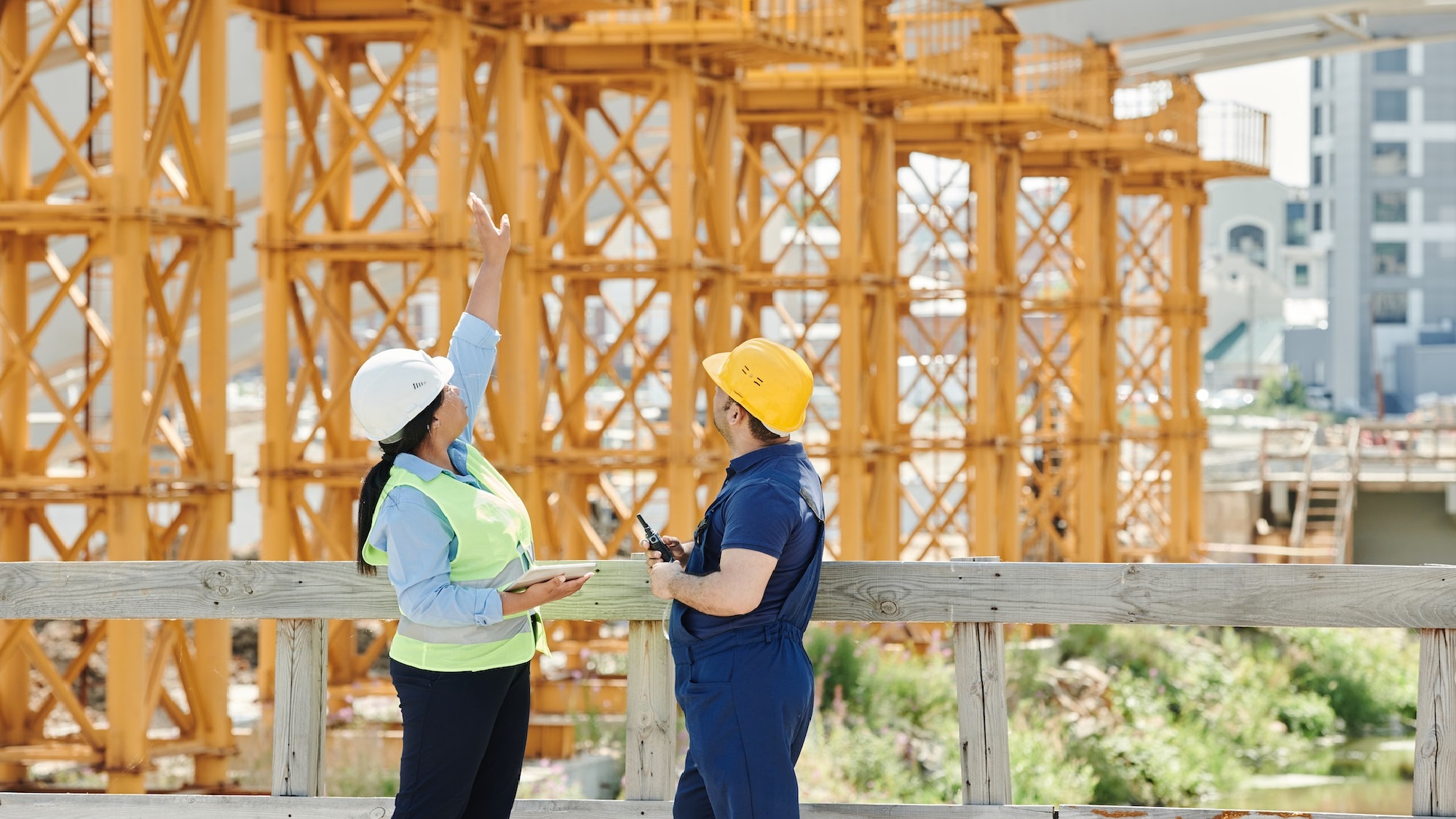 Couple sitting together on couch looking at laptop